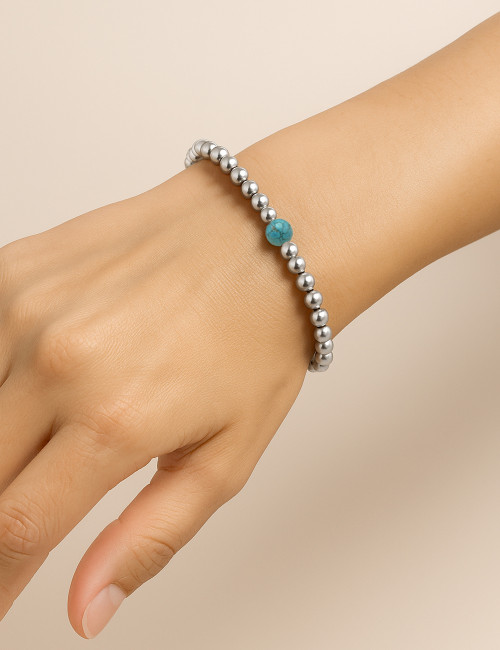 Pulseras bolas de plata y...